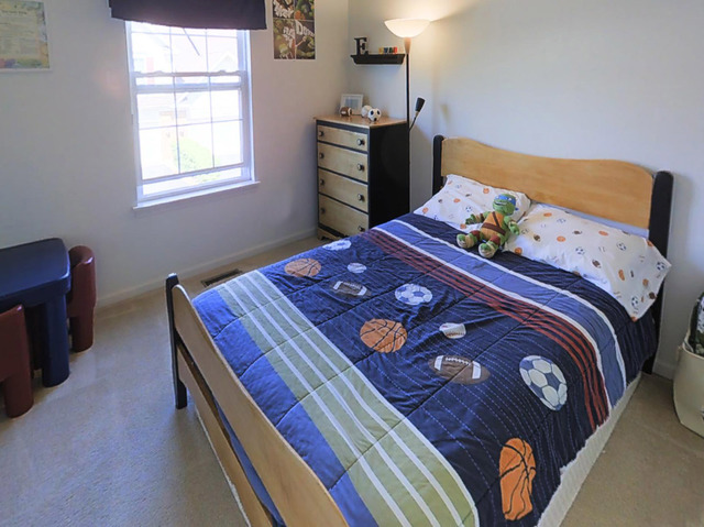 3129 Raphael Court St. Charles, IL 60175 - Photo 13 of 17 a bedroom with a bed and a dresser in it