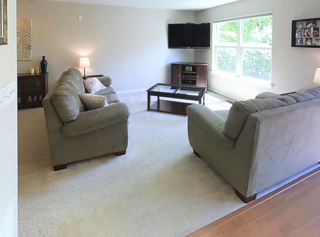 3129 Raphael Court St. Charles, IL 60175 - Photo 7 of 17 a living room with furniture a flat screen tv and a fireplace