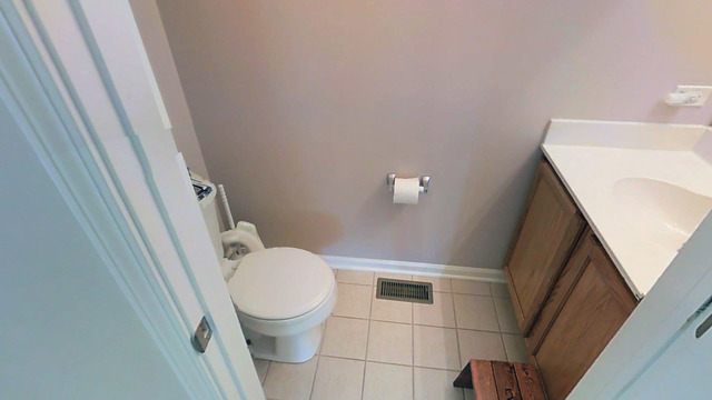 3129 Raphael Court St. Charles, IL 60175 - Photo 10 of 17 a white toilet sitting next to a sink and toilet