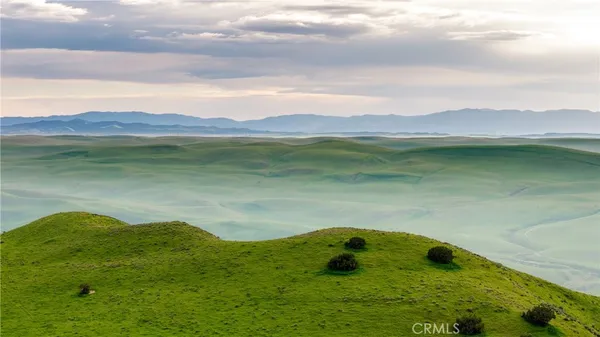 a view of a lake with a large mountain
