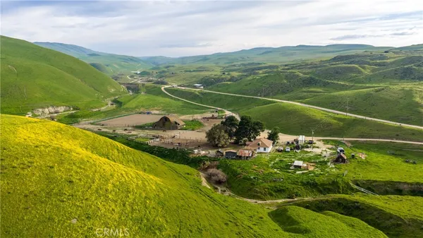 a view of a field with an ocean