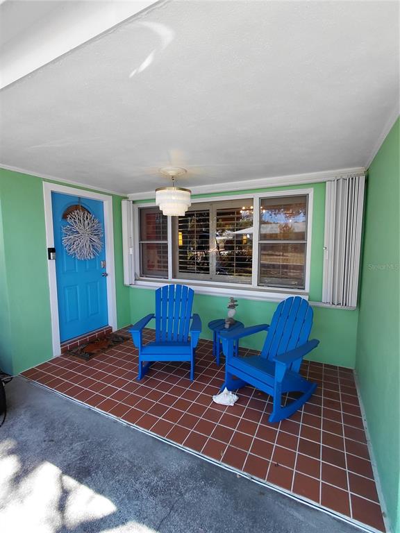 665 Marjon Avenue Dunedin, FL 34698 - Photo 1 of 1 a bedroom with furniture and a rug