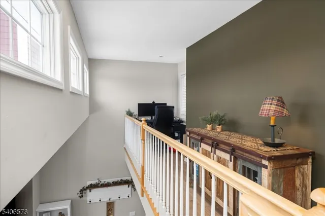 a view of a hallway with windows