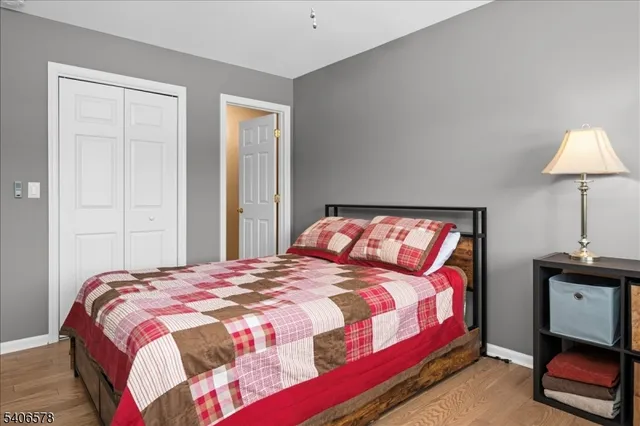 a bedroom with a bed and a lamp