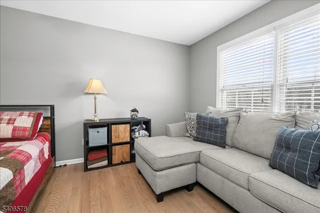 a living room with a couch and a lamp