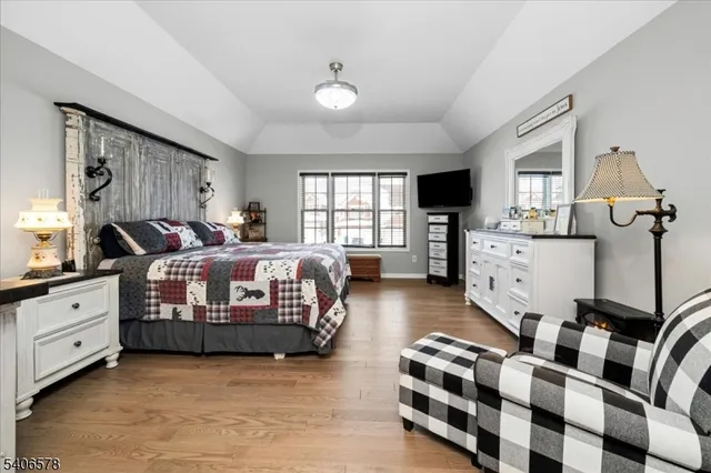 a bedroom with furniture and window