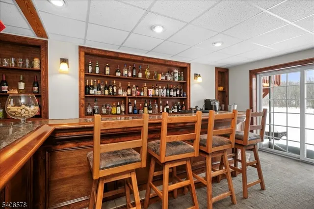 a dining room with furniture window and wooden floor