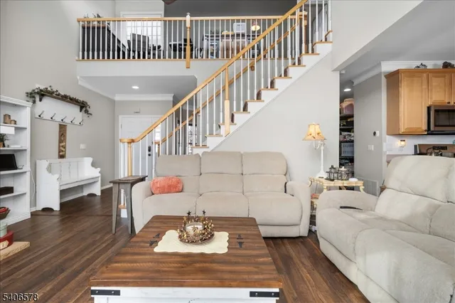 a living room with furniture or couch and a dining table