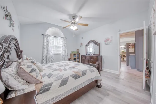 a bedroom with a bed furniture and a window