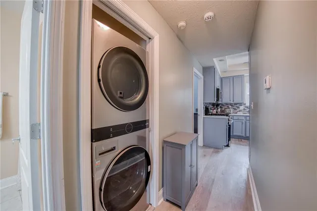 a view of a hallway with washer and dryer