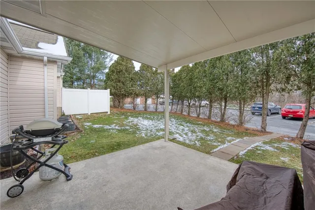 a view of a backyard with sitting area