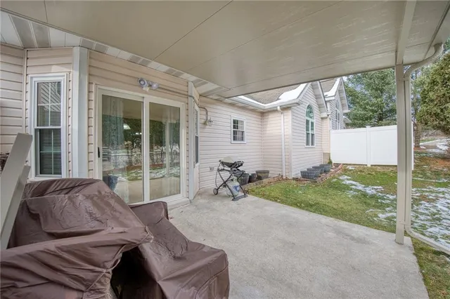 a view of backyard with patio