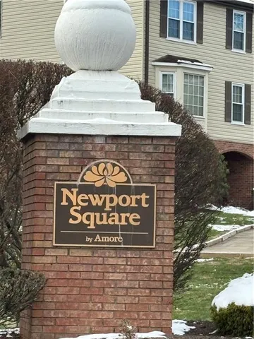 a sign that is on the side of a brick building