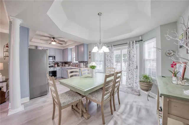 a view of a dining room with furniture window and wooden floor
