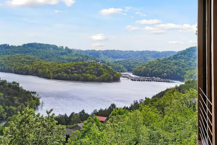 209 Sandgate Drive Smithville, TN 37166 - Photo 2 of 6 a view of a lake with a mountain in the background