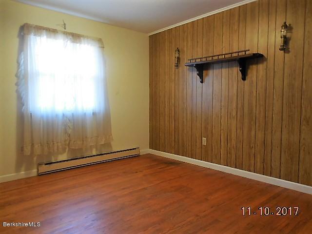 184 Washington Mountain Road Lee, MA 01238 - Photo 13 of 26 an empty room with wooden floor