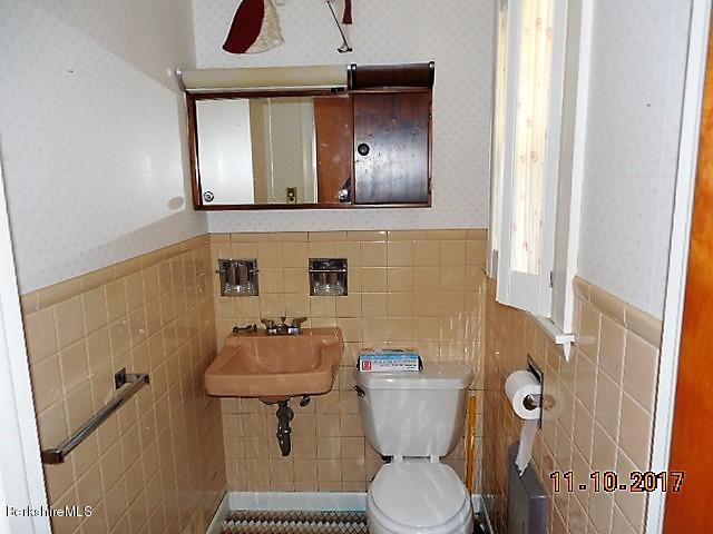 184 Washington Mountain Road Lee, MA 01238 - Photo 17 of 26 a bathroom with a toilet sink and mirror