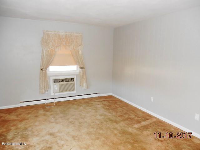 184 Washington Mountain Road Lee, MA 01238 - Photo 3 of 26 an empty room with a window