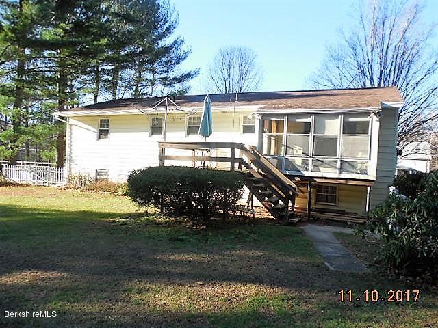 184 Washington Mountain Road Lee, MA 01238 - Photo 22 of 26 a front view of a house with a yard