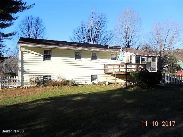 184 Washington Mountain Road Lee, MA 01238 - Photo 23 of 26 a front view of a house with a yard