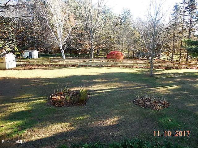 184 Washington Mountain Road Lee, MA 01238 - Photo 24 of 26 a view of a fountain in front of a house with a big yard