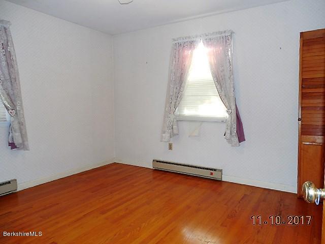 184 Washington Mountain Road Lee, MA 01238 - Photo 9 of 26 an empty room with a window