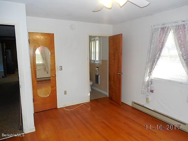 184 Washington Mountain Road Lee, MA 01238 - Photo 10 of 26 a view of an empty room with window and bathroom