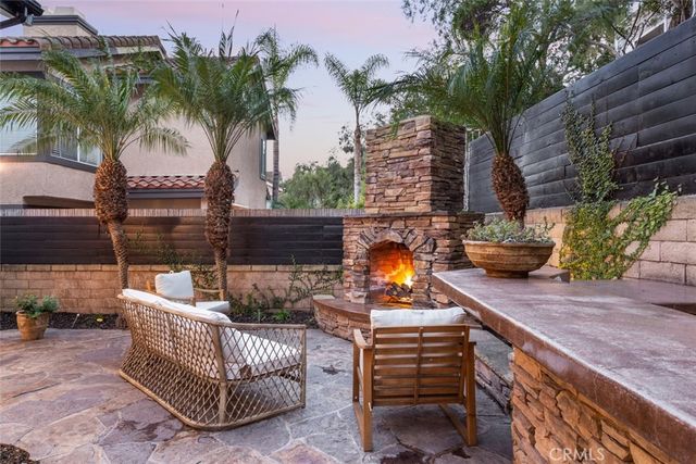 a view of a room with wooden floor and outdoor seating