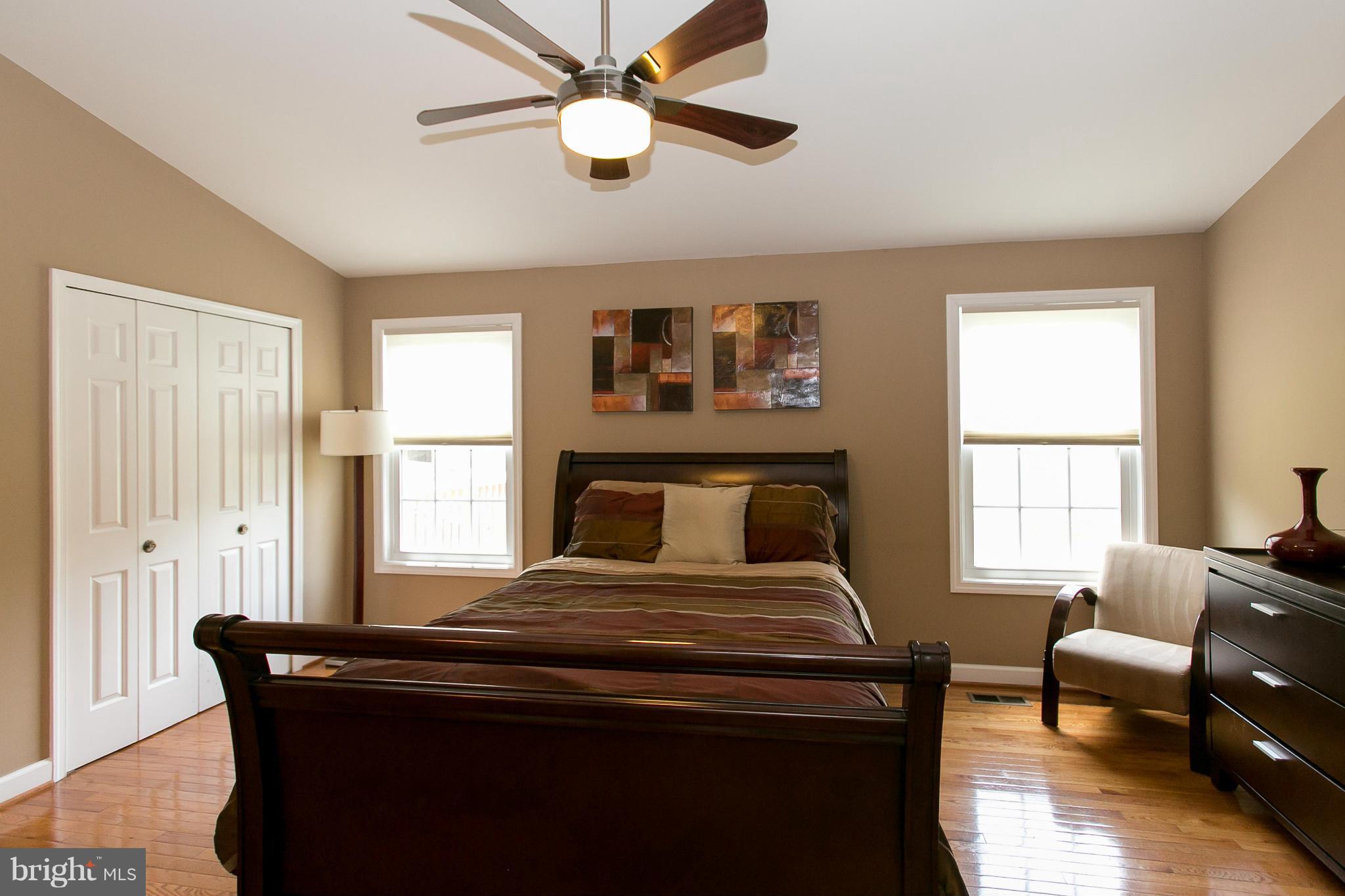 2913 Memory Lane Silver Spring, MD 20904 - Photo 14 of 28 a bedroom with a bed and wooden floor