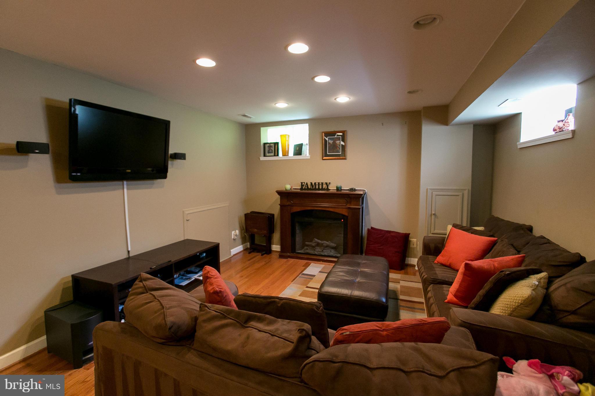 2913 Memory Lane Silver Spring, MD 20904 - Photo 22 of 28 a living room with furniture and a flat screen tv