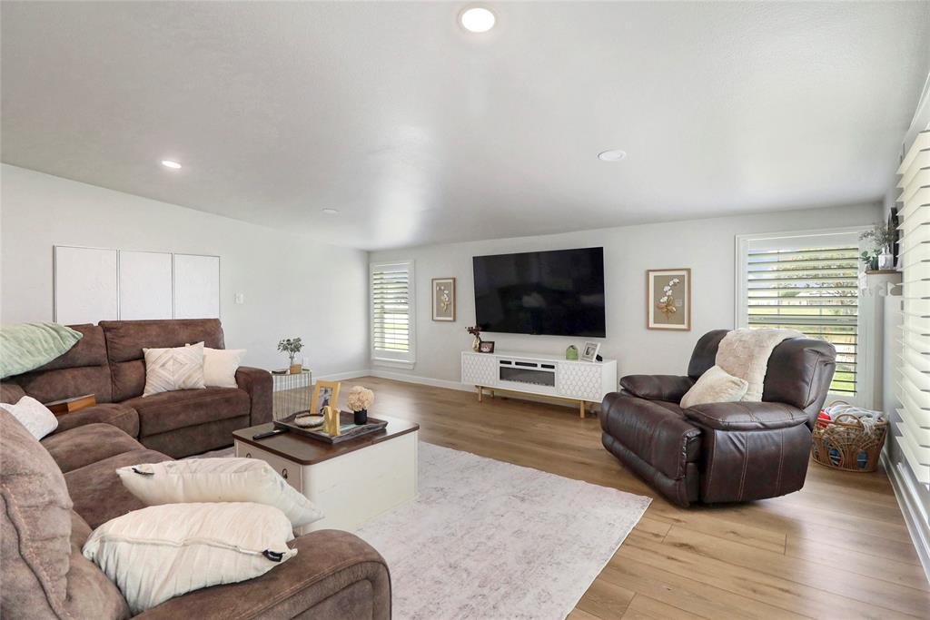 2408 Strader Road DISH, TX 76247 - Photo 9 of 40 a living room with furniture and a flat screen tv