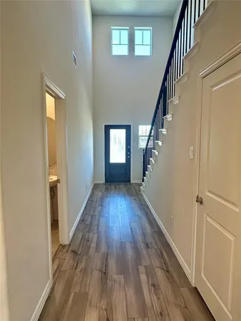 a view of entryway with wooden floor