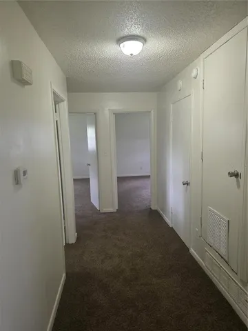 wooden floor in a hall with an entryway