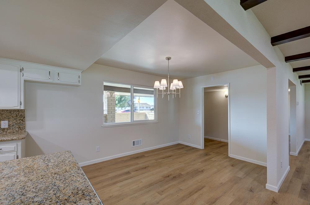 351 North Peach Avenue Clovis, CA 93612 - Photo 15 of 34 wooden floor in an empty room with a window