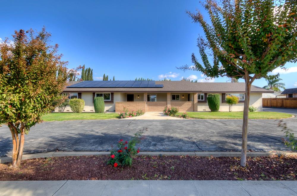 351 North Peach Avenue Clovis, CA 93612 - Photo 2 of 34 a front view of a house with garden