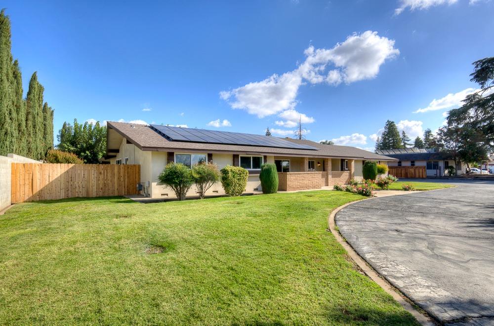 351 North Peach Avenue Clovis, CA 93612 - Photo 29 of 34 a view of a house with a big yard and large trees