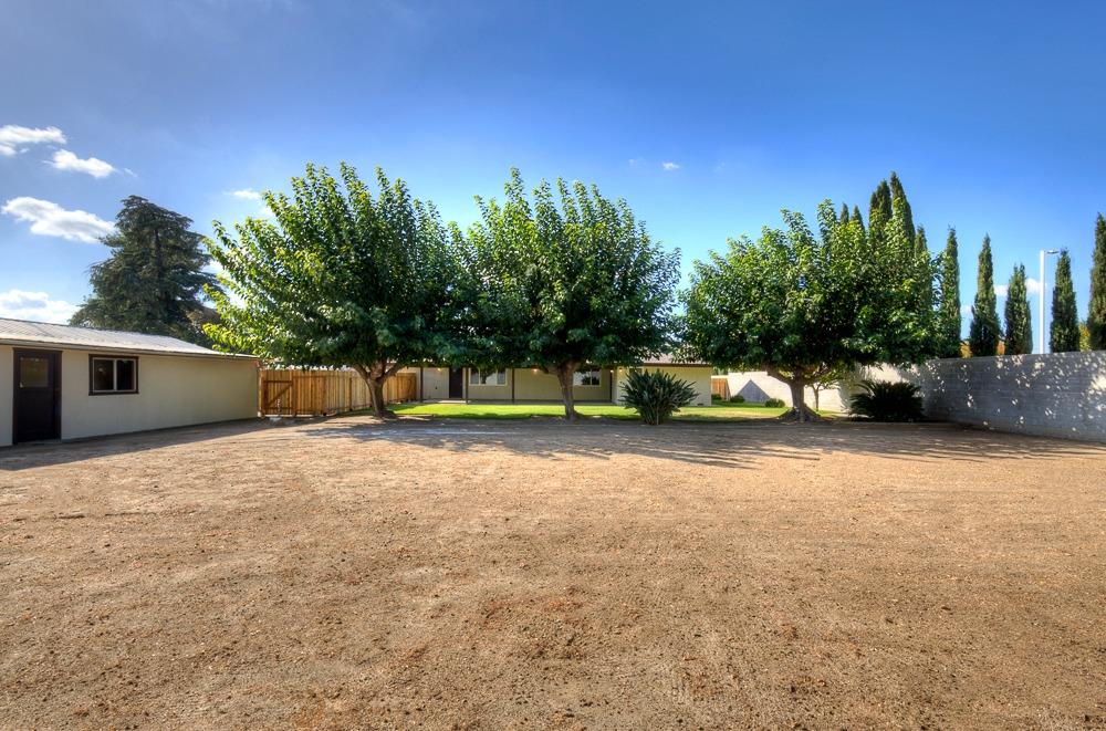 351 North Peach Avenue Clovis, CA 93612 - Photo 32 of 34 a view of a car parked in front of a house with trees
