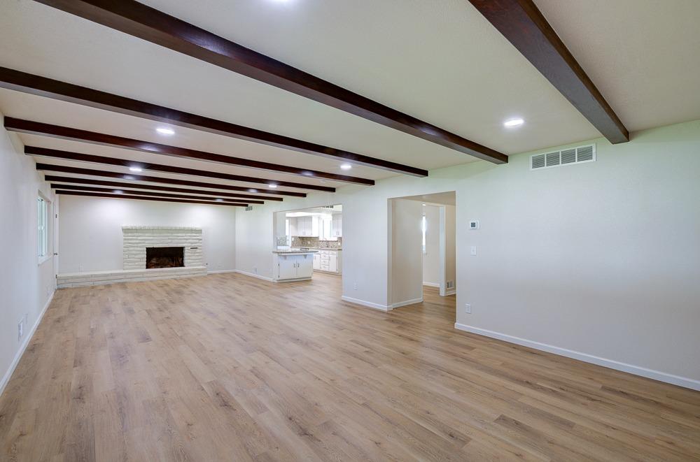 351 North Peach Avenue Clovis, CA 93612 - Photo 6 of 34 a view of empty room with wooden floor and fireplace