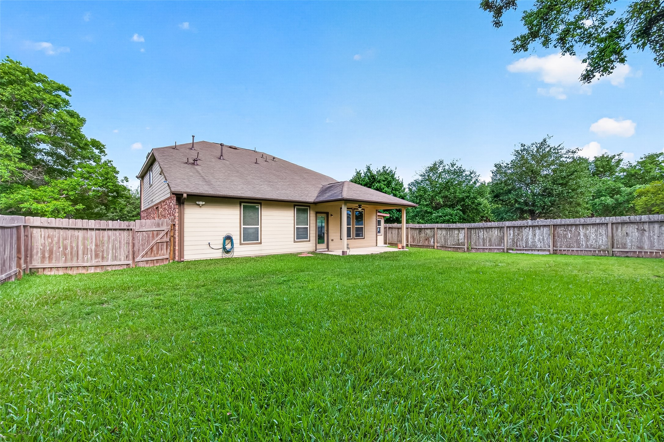8 Landscape Court Conroe, TX 77301 - Photo 42 of 43 a aerial view of a house next to a yard