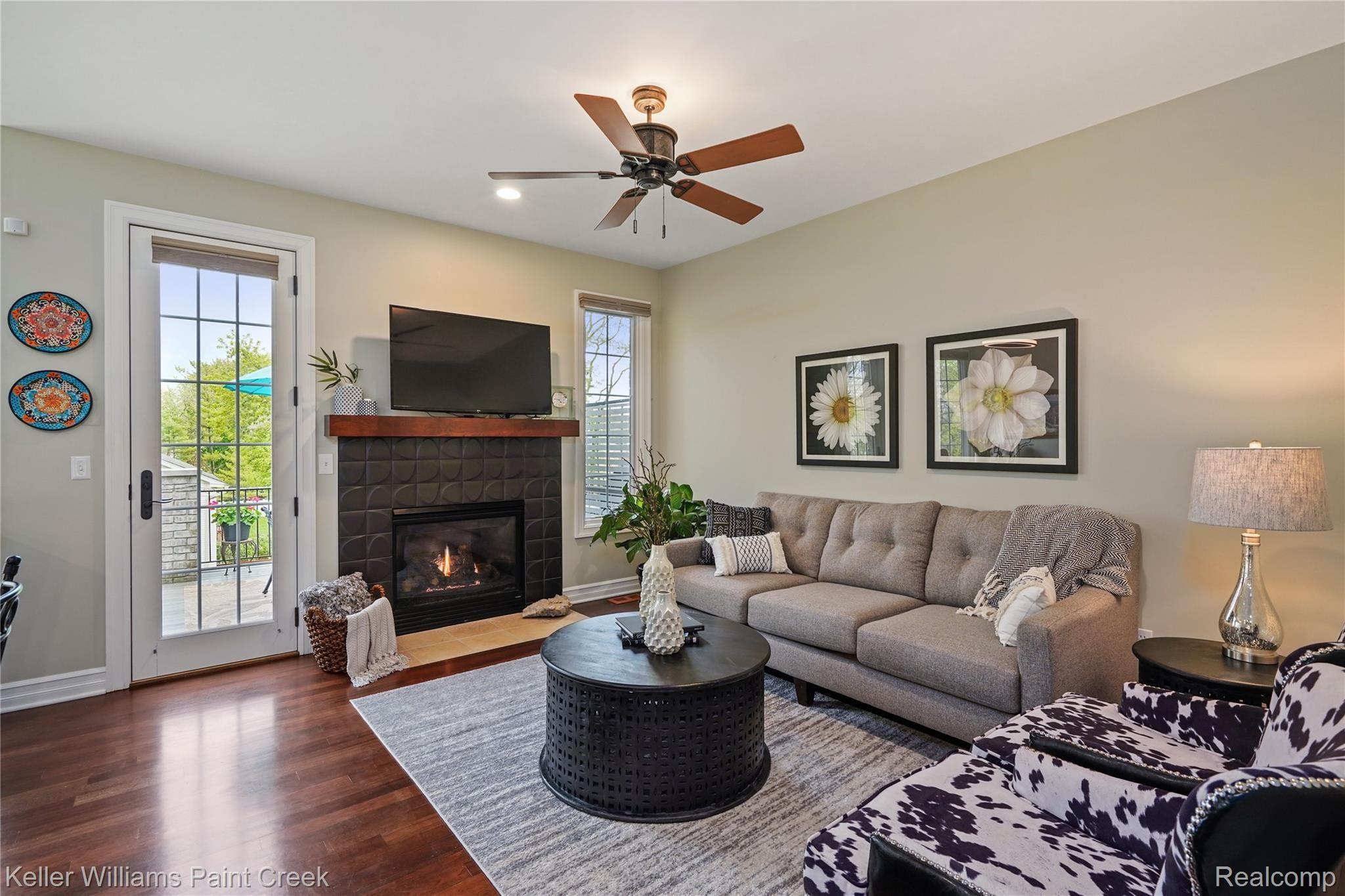 309 West 2nd Street Rochester, MI 48307 - Photo 5 of 19 The gathering room offers neutral decor and access to the private deck!