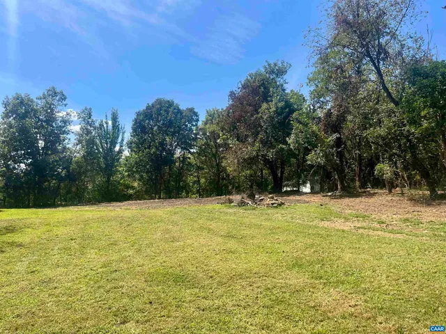 a view of a swimming pool with an outdoor space and seating area