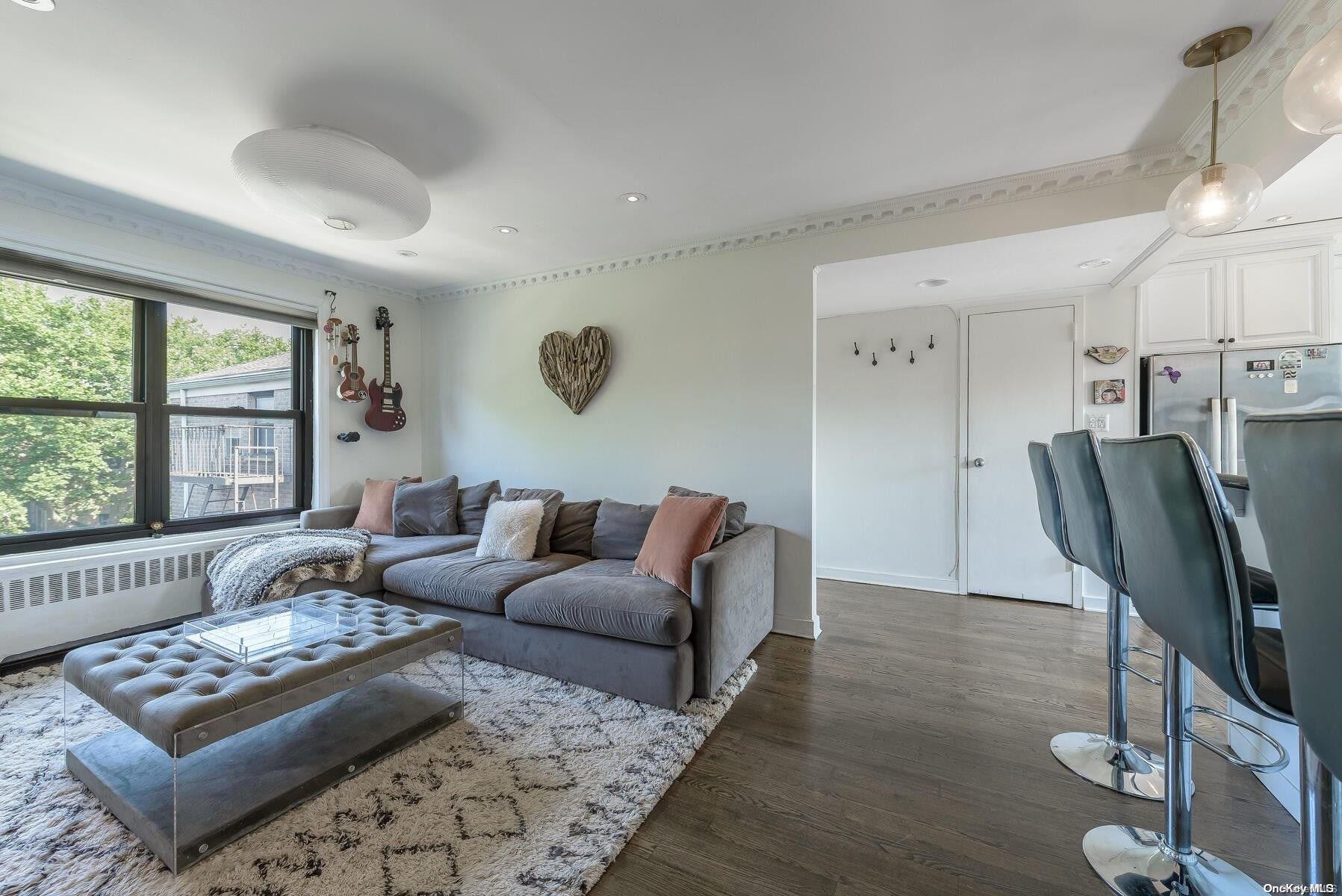 5 Terrace Circle, Unit 3D Great Neck, NY 11021 - Photo 1 of 1 a living room with furniture rug and window