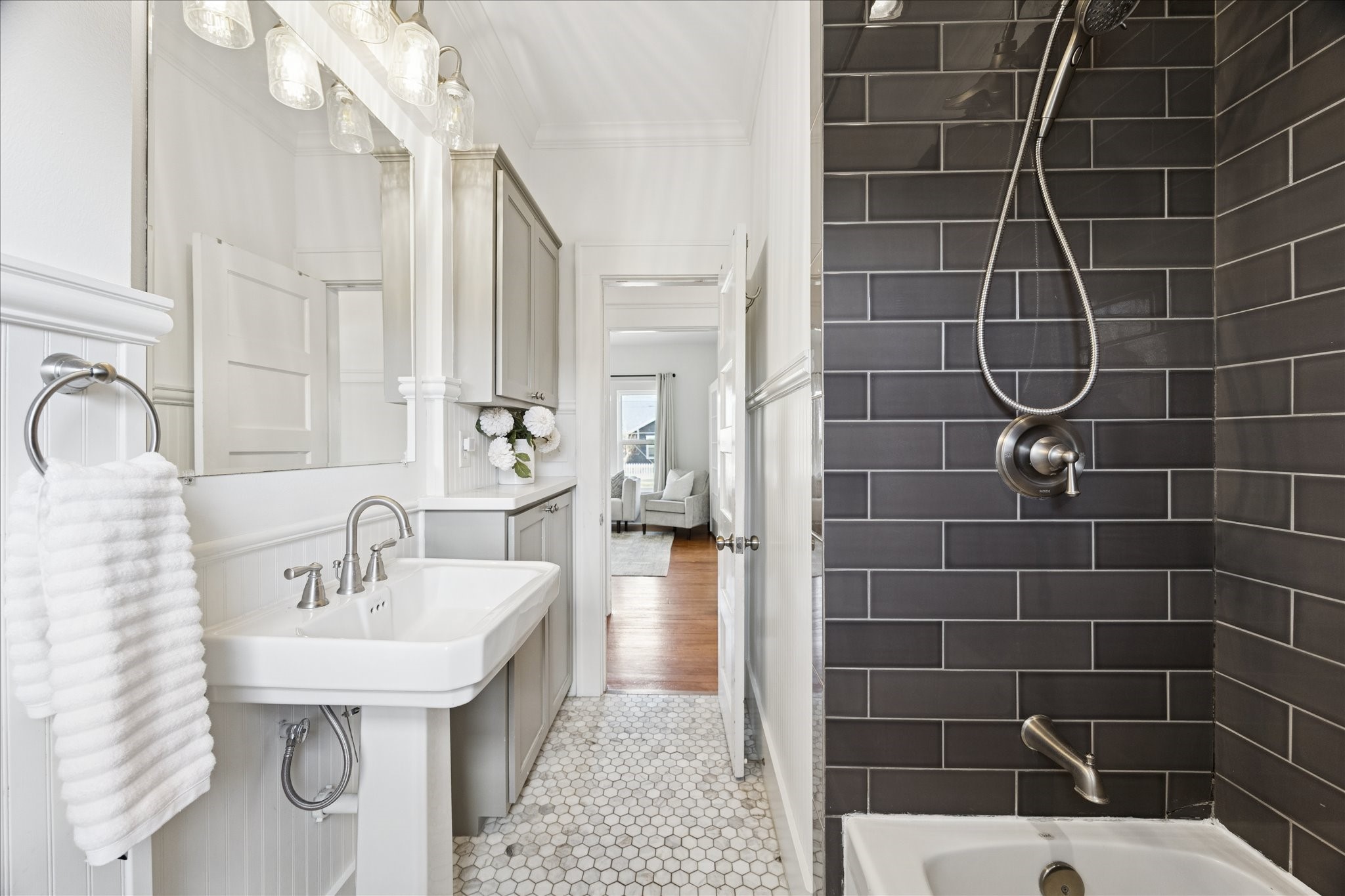 623 Pecore Street Houston, TX 77009 - Photo 20 of 34 Classic vanity area with built-in storage, sconce lighting, and timeless finishes.
