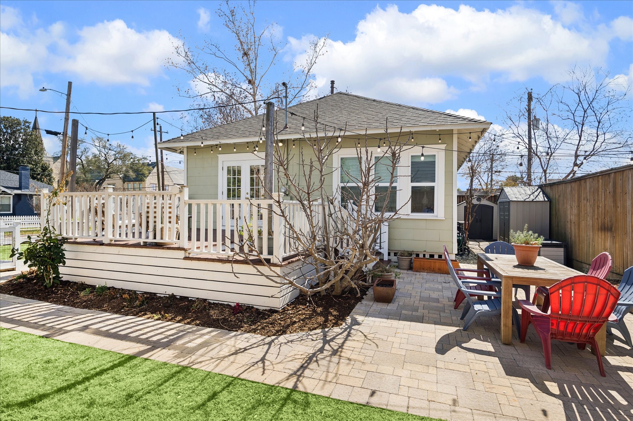 623 Pecore Street Houston, TX 77009 - Photo 27 of 34 Paver patio with dining space and garden beds, ideal for al fresco meals and entertaining.