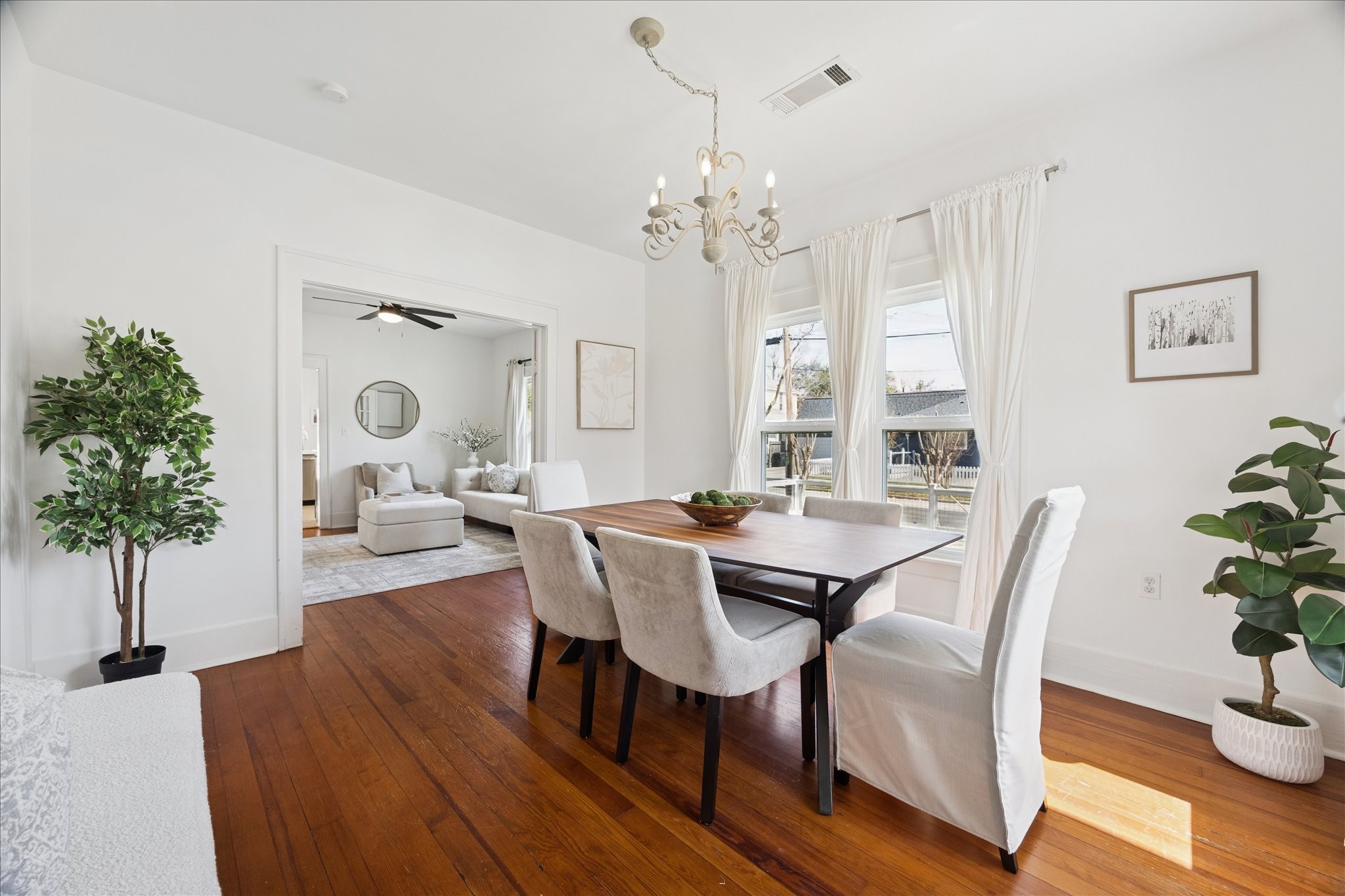 623 Pecore Street Houston, TX 77009 - Photo 6 of 34 Dining room opens seamlessly to the living room through wide cased openings, creating an airy, connected layout.