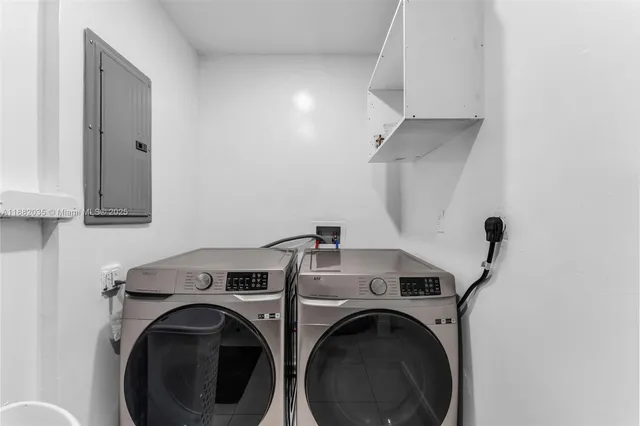 a white toilet sitting next to a bathroom sink