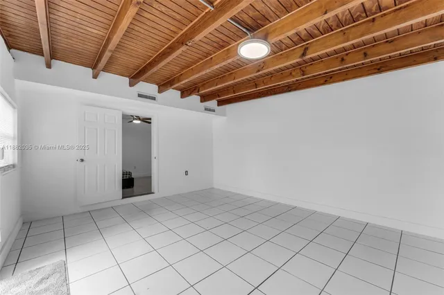 a bed room with a bed and a chandelier