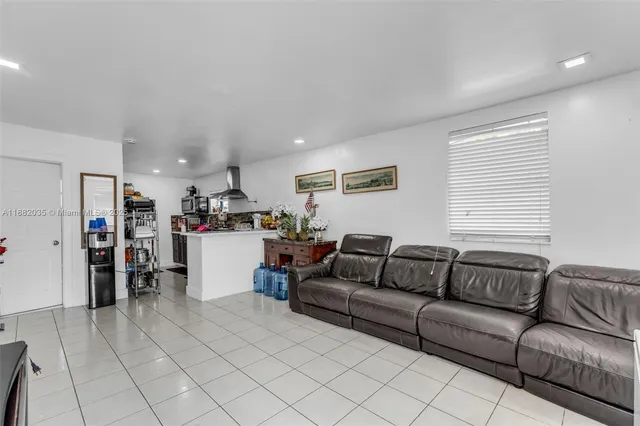 a view of a house with a yard and a garage
