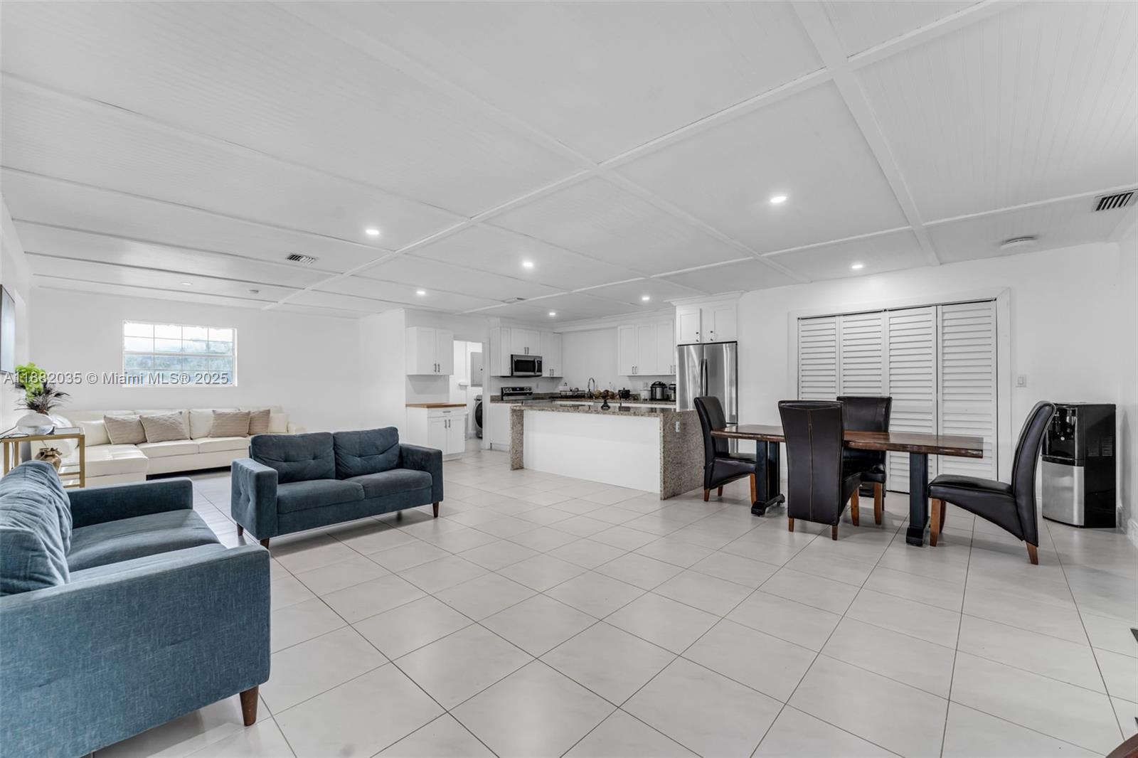 12750 Southwest 197th Avenue Miami, FL 33196 - Photo 4 of 60 a living room with furniture and kitchen view