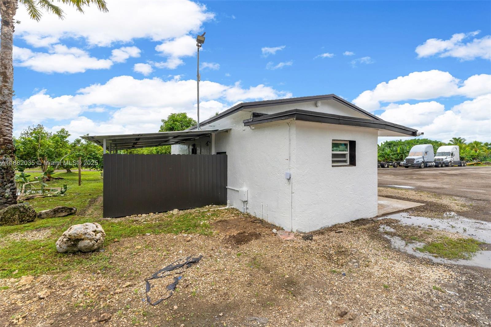 12750 Southwest 197th Avenue Miami, FL 33196 - Photo 44 of 60 a front view of a house with a yard